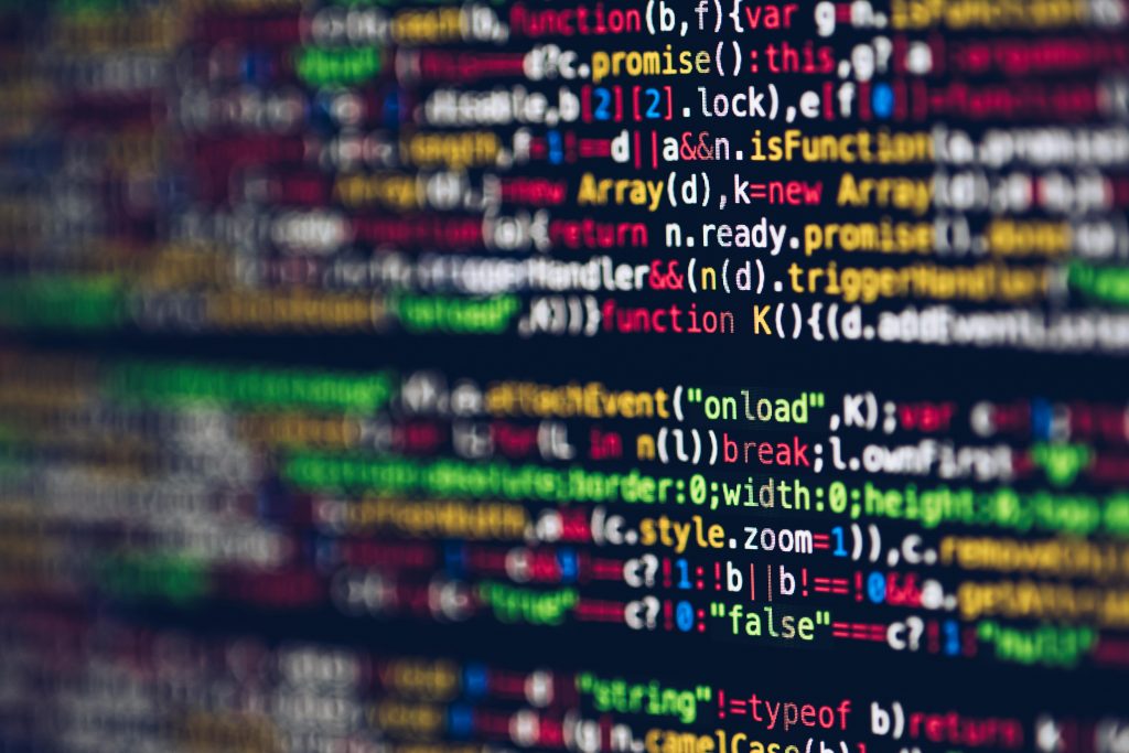 pexels-photo-2004161-2004161 Vivid, blurred close-up of colorful code on a screen, representing web development and programming.